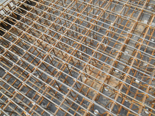 Hot rolled deformed steel bars or steel reinforcement bar tied together before cast in the concrete. Its function is to increase the concrete strength. 