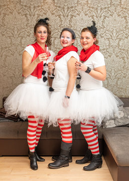 Three Women Dressed In Snowman Costume Celebrate Carnival