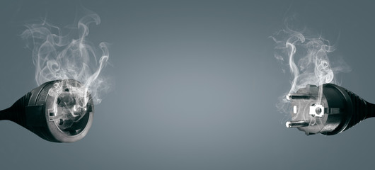 Technical difficulties concept - smoking electric plug and socket