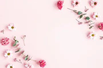 Zelfklevend Fotobehang Flowers composition. Pink flowers and eucalyptus branches on pink background. Valentines day, mothers day, womens day concept. Flat lay, top view © Flaffy