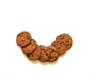 oatmeal cookies with pieces of chocolate on a white background