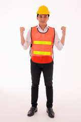 Young asian male construction worker in orange vest and yellow helmet. Isolate on white background.