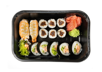 Plastic container with sushi set ready for takeout delivery