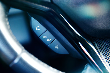 Phone control panel at the steering wheel in modern car