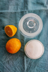 Slices of lemon in sugar, process. Hands cut lemon
