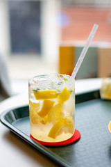 Honey lemon drink on the cafe table background