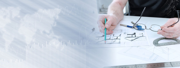 Architect working on plans; panoramic banner