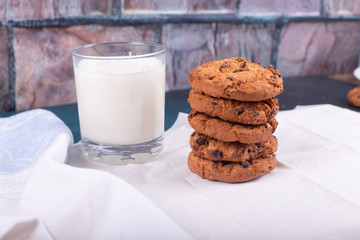 Oatmeal cookies with a glass of milk isolated on white