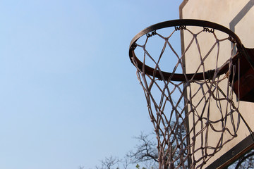 The old basketball hoop in a park at Bangkok