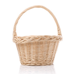 Rustic wicker basket isolated on white background.