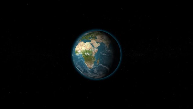 planet earth rotating on dark background