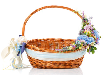 Fototapeta na wymiar Wicker design baskets are decorated with a floral arrangement for Easter.