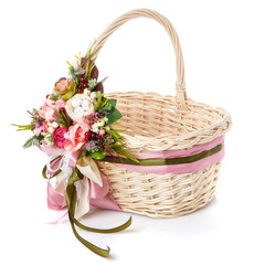Fototapeta na wymiar Basket decorated handmade. Festive basket decorated with flowers on white background.