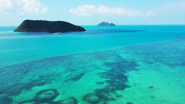 Beautiful cays in the aquamarine sea water. Aerial background. sunny summer day, Thailand