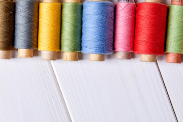 bobbins with thread and needles