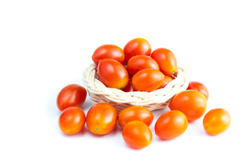 Cherry Tomatoes in a basket. (Solanum lycopersicum L. var. cerasiforme). isolated on white background and clipping path.