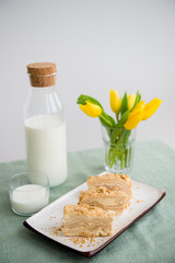 Piece of napoleon cake. Classic layered russian cake.  French mille feuille with whipped sour...
