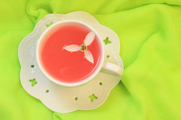 Cup of pink tea