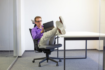 various positions sitting position at the office desk . man on chair working with tablet