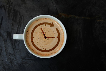 white cup with cappuccino and foam in the form of a pattern watch dial, top view, close-up, copy space