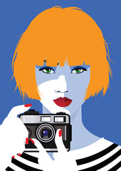 Red fashion woman with foto camera on blue background. 