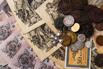 Gold and silver coins of the Russian Empire19 - 20 century in the background kopyur.Five rubles...