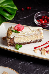American cuisine. Cheesecake cake with mascarpone cheese and almonds. Serving dishes in a restaurant on a white plate with tea. background image, copy space text