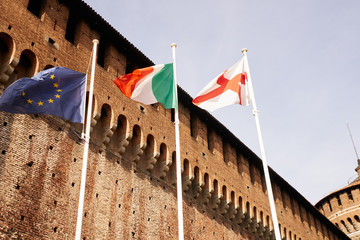 Flagstaffs in front of italian castle