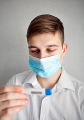 Young Man with a Thermometer