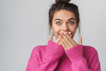 Image of nice excited woman smiling and covering her mouth