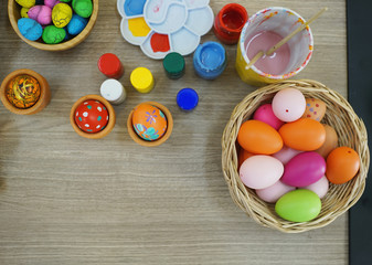 Fototapeta na wymiar Top view selective focus Easter eggs with colourful paint for Easter diy concept