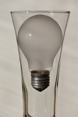 light bulb in an empty glass