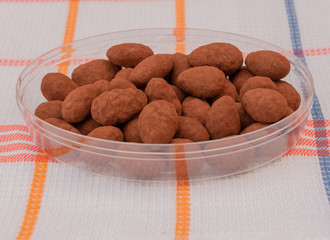Sweets, Chocolate with milk and almonds with natural cocoa powder