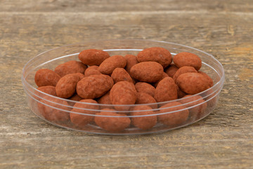 Sweets, Chocolate with milk and almonds with natural cocoa powder on wooden Background