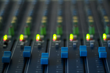 Mixing Desk, close up. Mixer control panel used in sound recording studios, radio sations and by DJ's