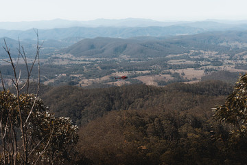 Mount Comboyne - December 30th 2019: A helicopter drops water on a spot fire as seen from the top...