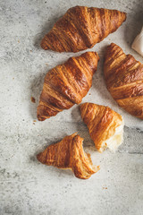 Fresh croissants, gray background, top view.