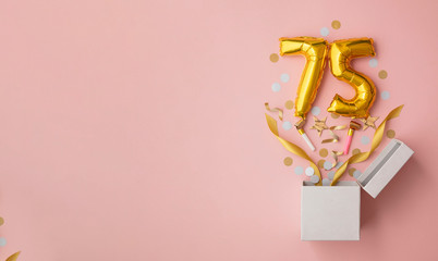 Number 75 birthday balloon celebration gift box lay flat explosion - obrazy, fototapety, plakaty