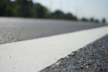 White traffic lane dividing line in Thailand