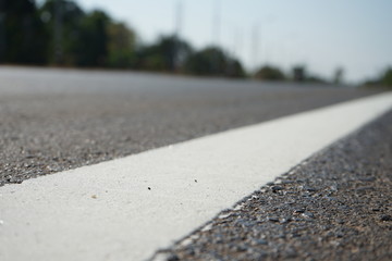 White traffic lane dividing line in Thailand