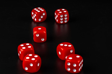 Group of dice close up on dark black background