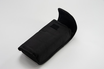 A black purse, a flash case or something else
