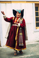 Woman dancing typical folkloric dances in traditional costume in Ladakh, Kashmir, India - 325677034