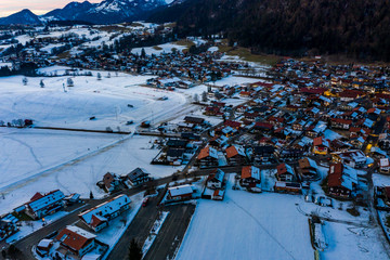 Fototapeta na wymiar Aerial view, Snowy Reit im Winkl at dusk, Chiemgau, Upper Bavaria, Bavaria, Germany