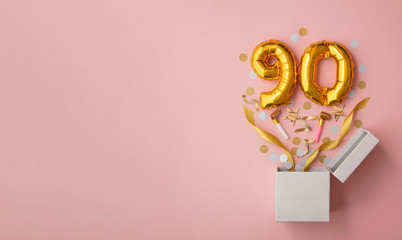 Number 90 birthday balloon celebration gift box lay flat explosion - obrazy, fototapety, plakaty