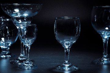 Empty  glasses for drinks on dark background