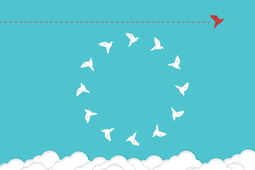 Think differently concept. Be different. Red bird changing direction. New idea, change, trend, courage, creative solution, innovation and unique way concept.	