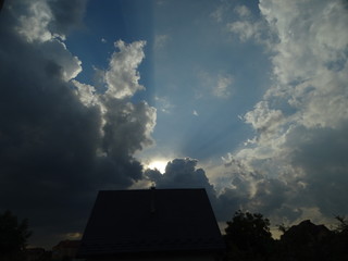 sky with clouds over the house