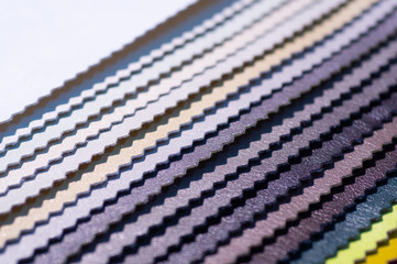 Catalog of multicolored imitation leather. Leatherette samples texture. Industry background