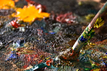 Artist mixing color oil painting on palette. Palette with paintbrush